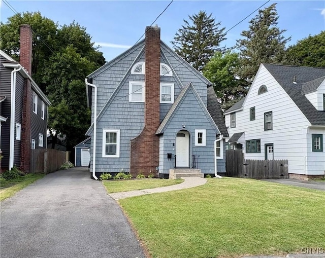 153 Milnor Ave, Syracuse, NY 13224 - view of front of home with an outbuilding, a chimney, and driveway