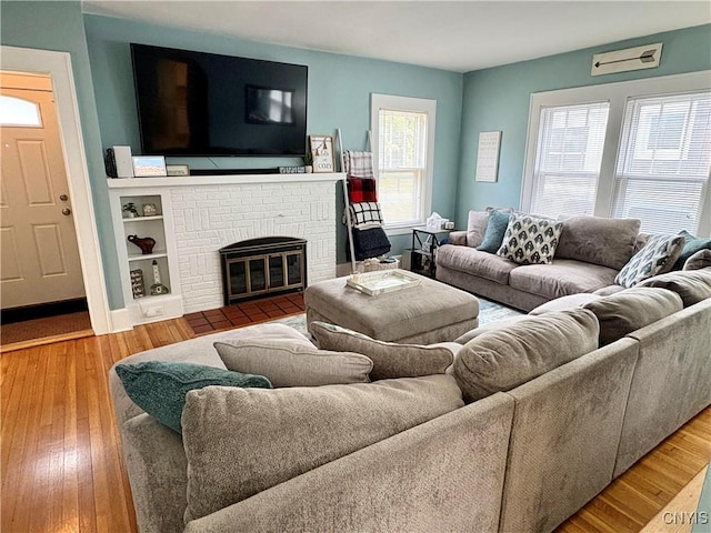 153 Milnor Ave, Syracuse, NY 13224 - living room with hardwood / wood-style floors and a brick fireplace