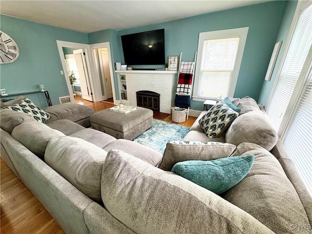 153 Milnor Ave, Syracuse, NY 13224 - living area featuring wood finished floors and a fireplace