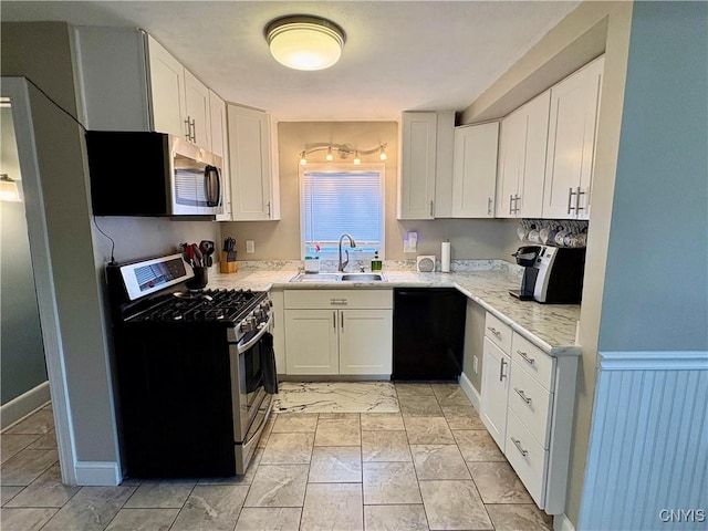 153 Milnor Ave, Syracuse, NY 13224 - kitchen featuring appliances with stainless steel finishes, white cabinets, light marble finish flooring, and light stone counters