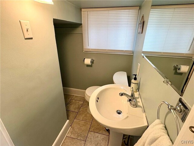 153 Milnor Ave, Syracuse, NY 13224 - half bath featuring toilet and tile patterned flooring