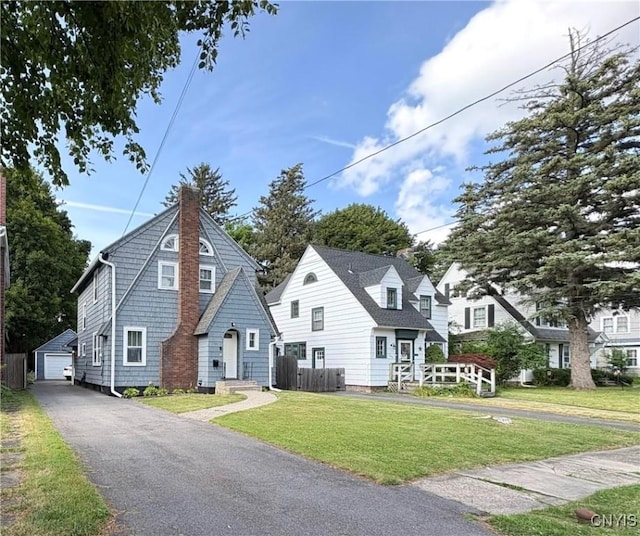 153 Milnor Ave, Syracuse, NY 13224 - view of front of house featuring an outdoor structure, a chimney, and a garage