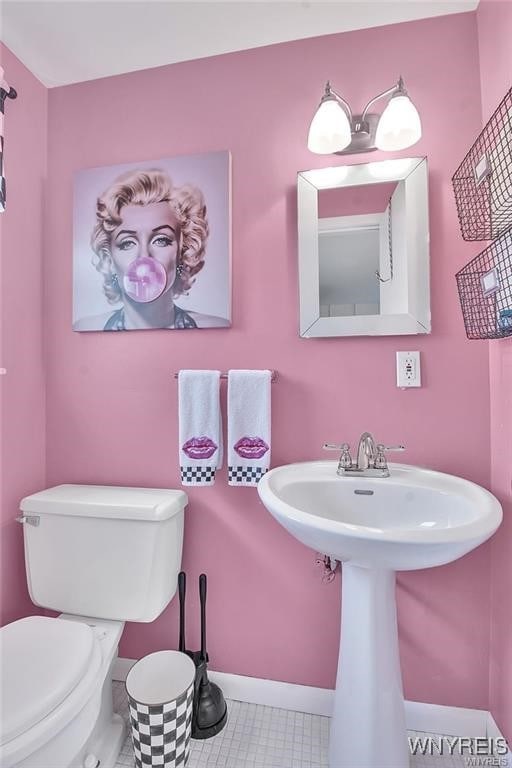 72 Old Lyme Dr Unit 3, Amherst, NY 14221 - half bath with toilet and tile patterned floors