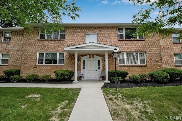 72 Old Lyme Dr Unit 3, Amherst, NY 14221 - colonial house with a front yard and brick siding