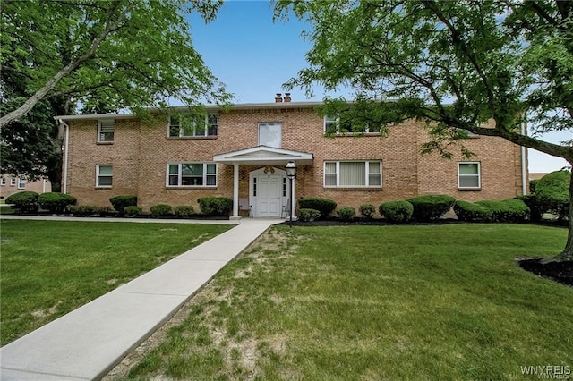 72 Old Lyme Dr Unit 3, Amherst, NY 14221 - colonial house with a front yard and brick siding