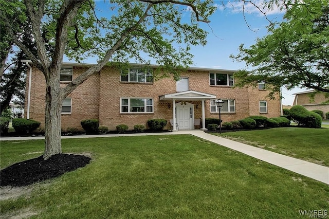 72 Old Lyme Dr Unit 3, Amherst, NY 14221 - colonial home with a front yard and brick siding