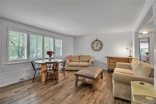 72 Old Lyme Dr Unit 3, Amherst, NY 14221 - living room featuring hardwood / wood-style floors and wooden walls
