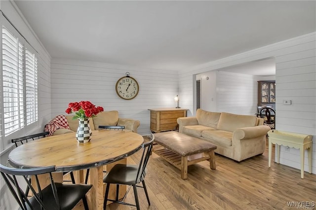 72 Old Lyme Dr Unit 3, Amherst, NY 14221 - dining area with wood walls and light wood finished floors