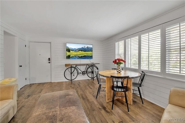 72 Old Lyme Dr Unit 3, Amherst, NY 14221 - dining area featuring wood finished floors and wood walls