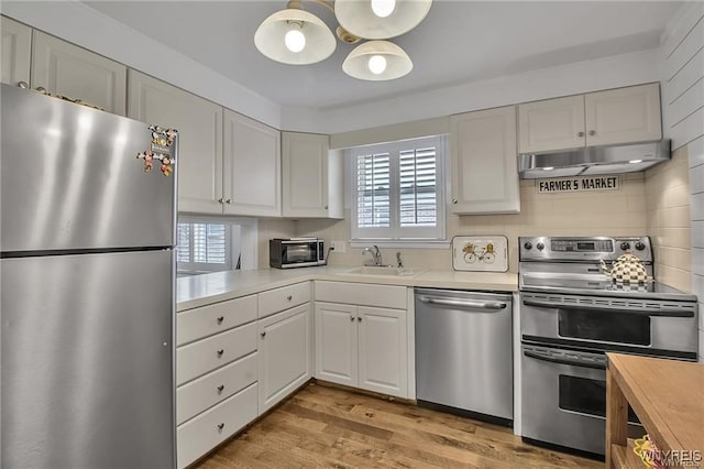 72 Old Lyme Dr Unit 3, Amherst, NY 14221 - kitchen featuring appliances with stainless steel finishes, healthy amount of natural light, and white cabinets