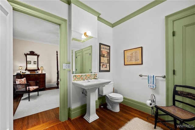 107 Oakland Pl Unit 1, Buffalo, NY 14222 - bathroom with ornamental molding and wood finished floors