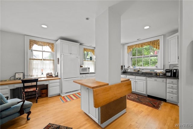 107 Oakland Pl Unit 1, Buffalo, NY 14222 - kitchen featuring white appliances, wood counters, light wood finished floors, white cabinets, and recessed lighting