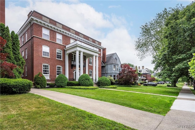 107 Oakland Pl Unit 1, Buffalo, NY 14222 - view of front of property featuring brick siding and a front yard