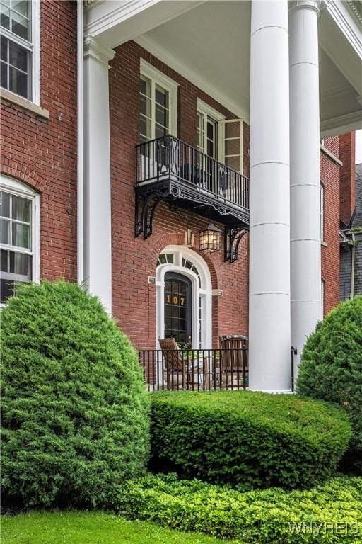 107 Oakland Pl Unit 1, Buffalo, NY 14222 - doorway to property with brick siding and a balcony