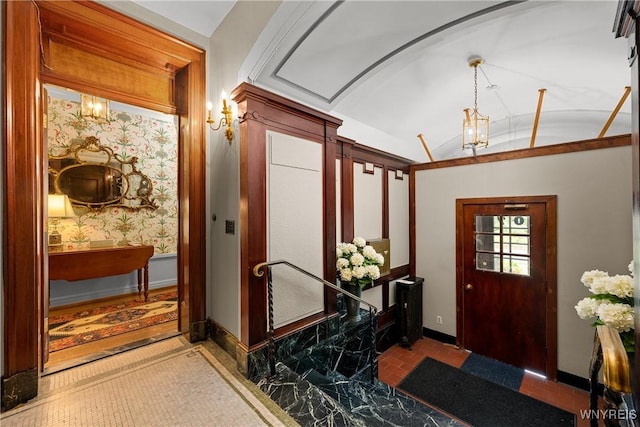 107 Oakland Pl Unit 1, Buffalo, NY 14222 - foyer with baseboards and lofted ceiling