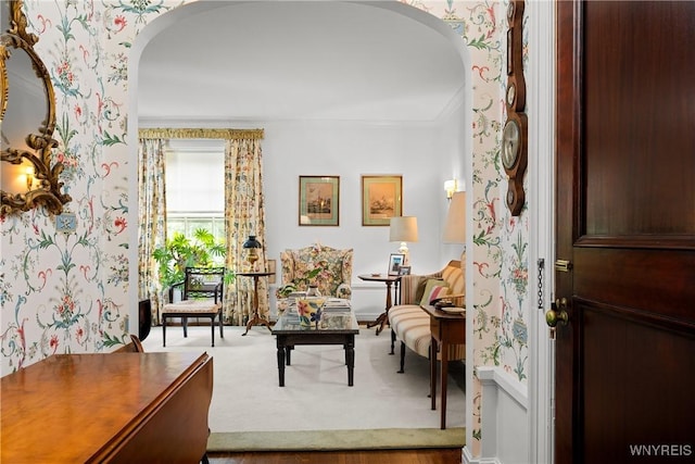 107 Oakland Pl Unit 1, Buffalo, NY 14222 - entrance foyer featuring wallpapered walls, arched walkways, and crown molding