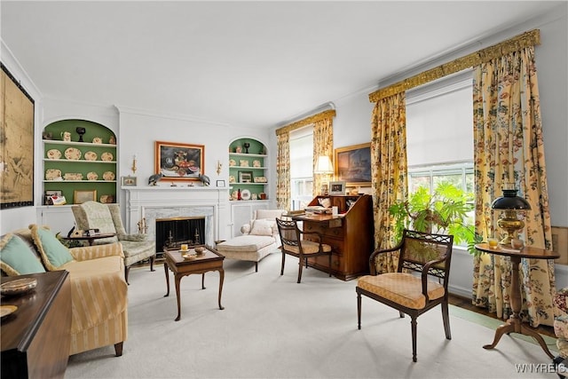 107 Oakland Pl Unit 1, Buffalo, NY 14222 - carpeted living room featuring built in features, a fireplace, and crown molding
