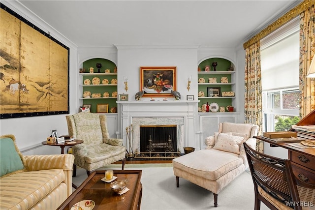 107 Oakland Pl Unit 1, Buffalo, NY 14222 - sitting room featuring built in shelves and a high end fireplace