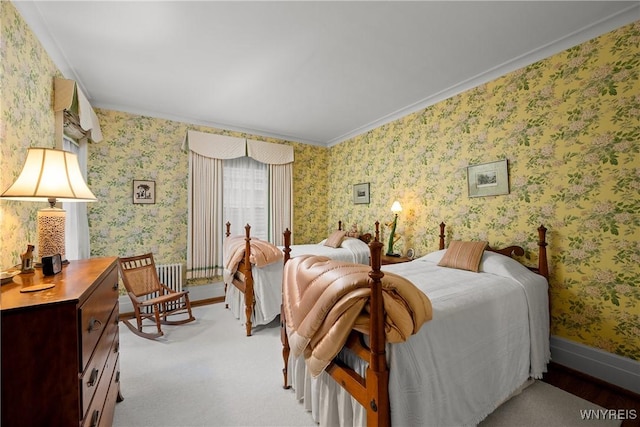 107 Oakland Pl Unit 1, Buffalo, NY 14222 - bedroom with wallpapered walls, crown molding, and carpet