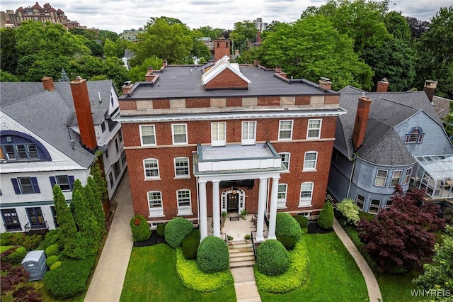 107 Oakland Pl Unit 1, Buffalo, NY 14222 - colonial-style house featuring brick siding and a chimney