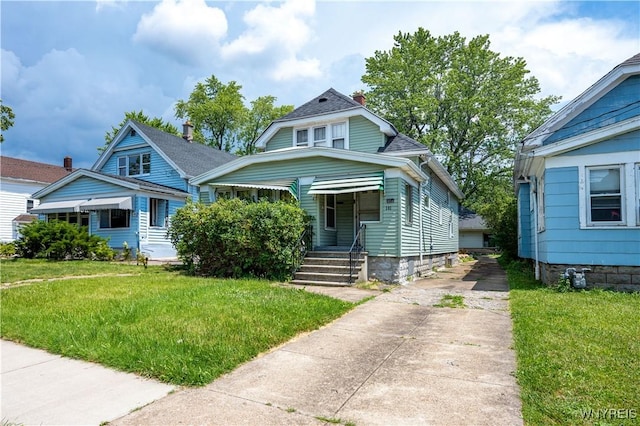 181 Ericson Ave, Buffalo, NY 14215 - bungalow-style home featuring a front yard and concrete driveway