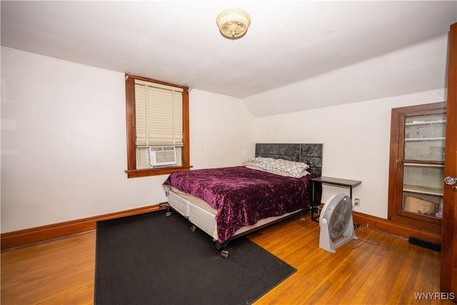 181 Ericson Ave, Buffalo, NY 14215 - bedroom with cooling unit, hardwood / wood-style flooring, and lofted ceiling