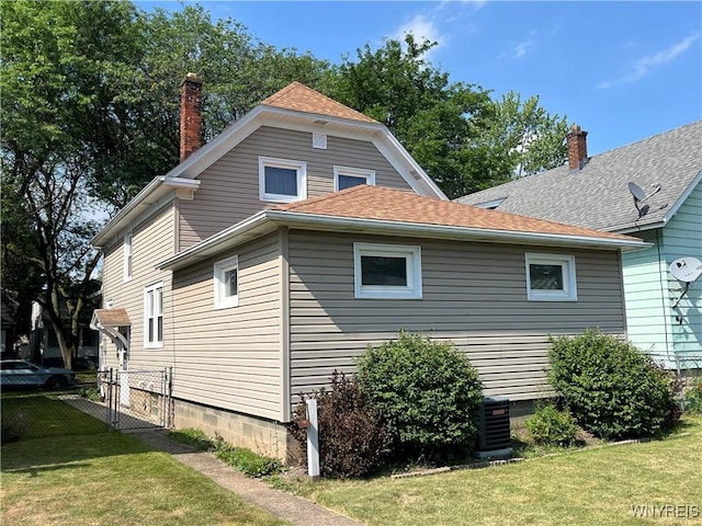 2461 Linwood Ave, Niagara Falls, NY 14305 - view of home's exterior featuring a chimney, a gate, and a shingled roof
