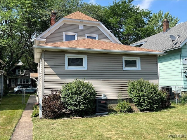 2461 Linwood Ave, Niagara Falls, NY 14305 - view of home's exterior featuring roof with shingles and a chimney