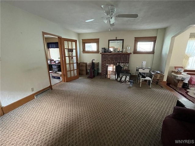 2461 Linwood Ave, Niagara Falls, NY 14305 - sitting room featuring plenty of natural light, carpet flooring, french doors, and a brick fireplace