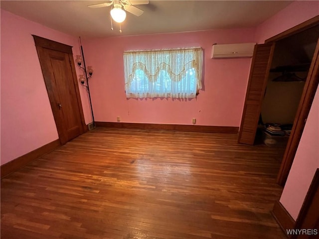2461 Linwood Ave, Niagara Falls, NY 14305 - unfurnished bedroom with wood finished floors, a wall mounted air conditioner, and ceiling fan