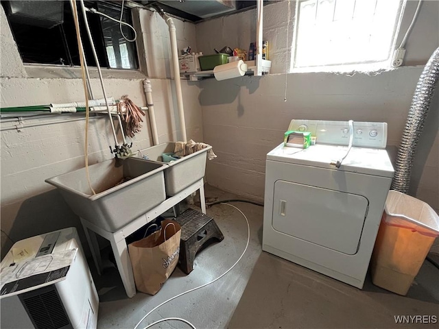 2461 Linwood Ave, Niagara Falls, NY 14305 - laundry area featuring washer / dryer, concrete block wall, and plenty of natural light
