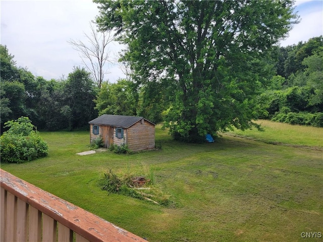 5465 Ridge Rd, Fleming, NY 13021 - view of grassy yard featuring an outbuilding and a wooded view