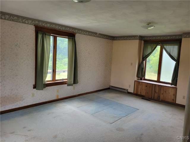 5465 Ridge Rd, Fleming, NY 13021 - carpeted spare room with baseboard heating, plenty of natural light, and wallpapered walls