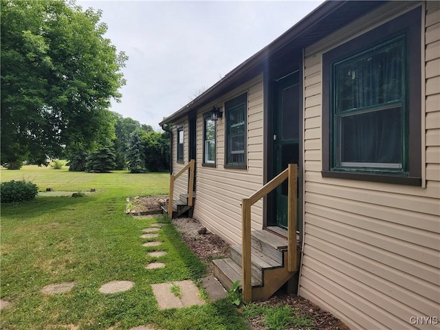 5465 Ridge Rd, Fleming, NY 13021 - view of property exterior with entry steps and a yard