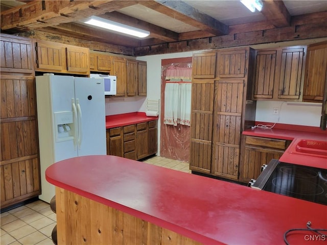 5465 Ridge Rd, Fleming, NY 13021 - kitchen with white appliances, beamed ceiling, light tile patterned flooring, and brown cabinetry