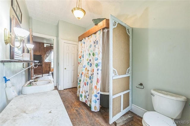 6192 Scudder Rd, Bath, NY 14879 - full bathroom with wood finished floors and a shower with curtain