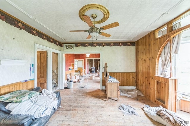 6192 Scudder Rd, Bath, NY 14879 - bedroom with hardwood / wood-style flooring, wooden walls, and a ceiling fan