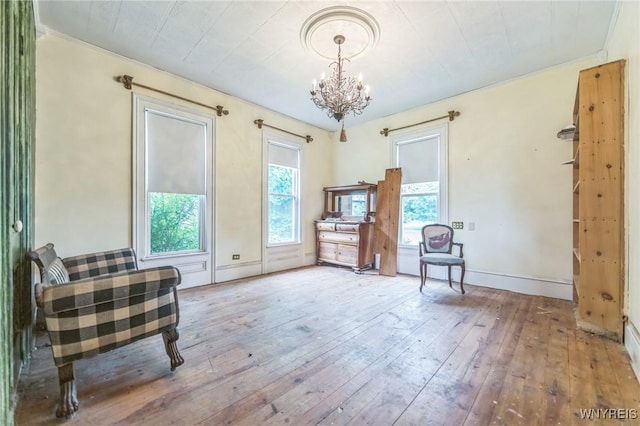 6192 Scudder Rd, Bath, NY 14879 - sitting room with hardwood / wood-style flooring, a chandelier, and ornamental molding