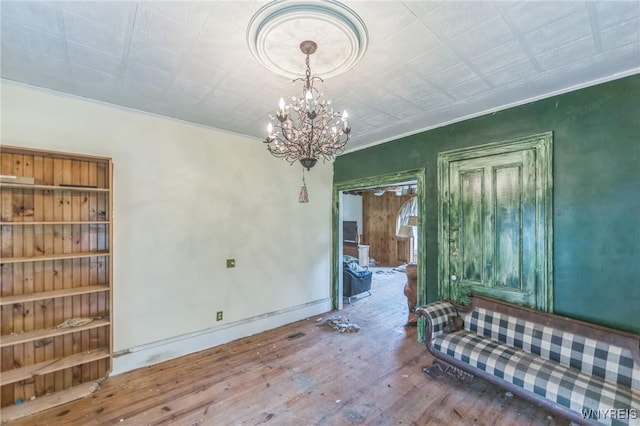 6192 Scudder Rd, Bath, NY 14879 - unfurnished room featuring hardwood / wood-style flooring and a chandelier