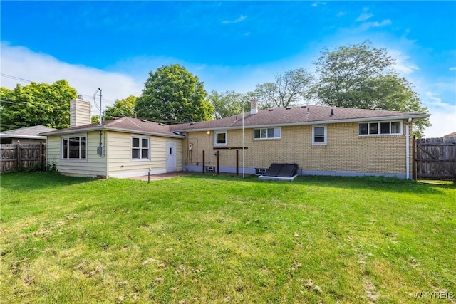 202 Waltercrest, West Seneca, NY 14224 - back of house with brick siding, a chimney, and a patio area