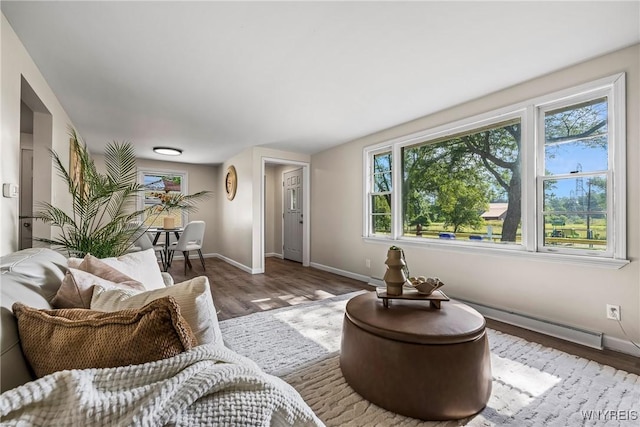 202 Waltercrest, West Seneca, NY 14224 - living room featuring wood finished floors and a baseboard heating unit