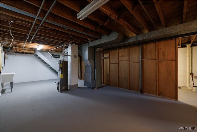 202 Waltercrest, West Seneca, NY 14224 - unfinished below grade area featuring stairs, heating unit, and gas water heater