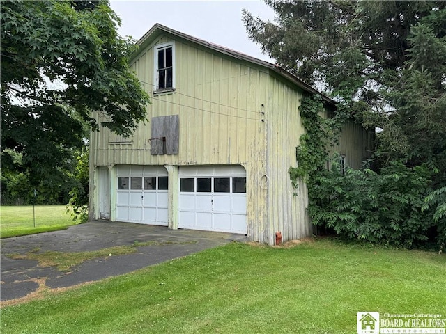 5469 E Lake Rd, Chautauqua, NY 14728 - view of home's exterior with a lawn and a detached garage