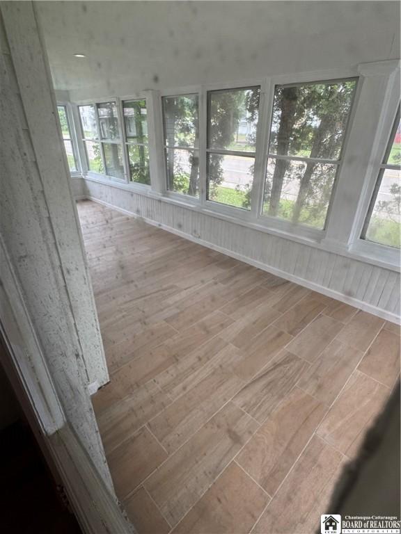 5469 E Lake Rd, Chautauqua, NY 14728 - unfurnished sunroom featuring wood finished floors