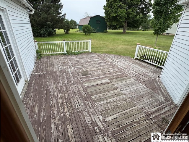 5469 E Lake Rd, Chautauqua, NY 14728 - wooden deck featuring a lawn