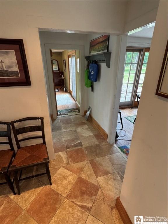 5469 E Lake Rd, Chautauqua, NY 14728 - hallway with stone finish flooring and baseboards
