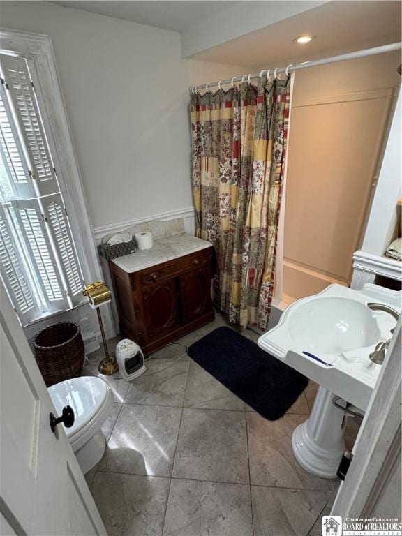 5469 E Lake Rd, Chautauqua, NY 14728 - bathroom featuring toilet and shower / bath combo with shower curtain
