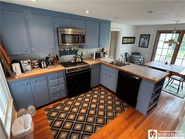 5469 E Lake Rd, Chautauqua, NY 14728 - kitchen featuring black appliances, a peninsula, wood counters, open shelves, and dark wood-style floors