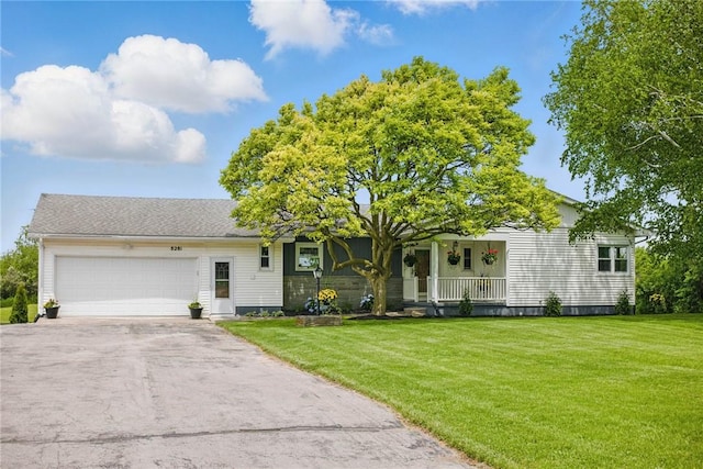 8281 E Main Rd, Leroy, NY 14482 - single story home with covered porch, an attached garage, a front lawn, and driveway