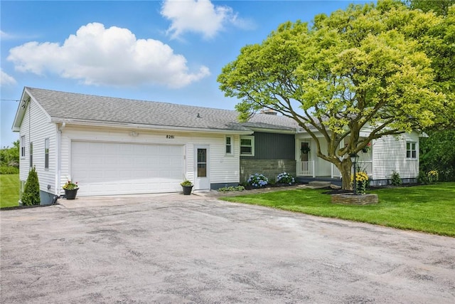8281 E Main Rd, Leroy, NY 14482 - ranch-style home featuring a garage, driveway, a front yard, and roof with shingles